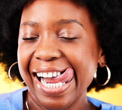 Buy stock photo Tongue out, comic and closeup of black woman on a yellow background for happiness or crazy. Smile, face and an African girl or model with a silly or funny expression with comedy or goofy personality