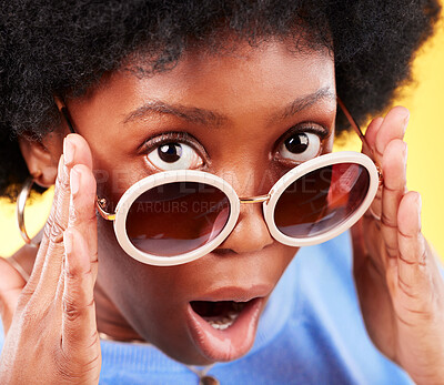 Buy stock photo Surprise, black woman and shock on face with sunglasses, fashion and crazy sale, deal or offer in studio background. Confused, face and African person with shocked, wow or emoji for promotion