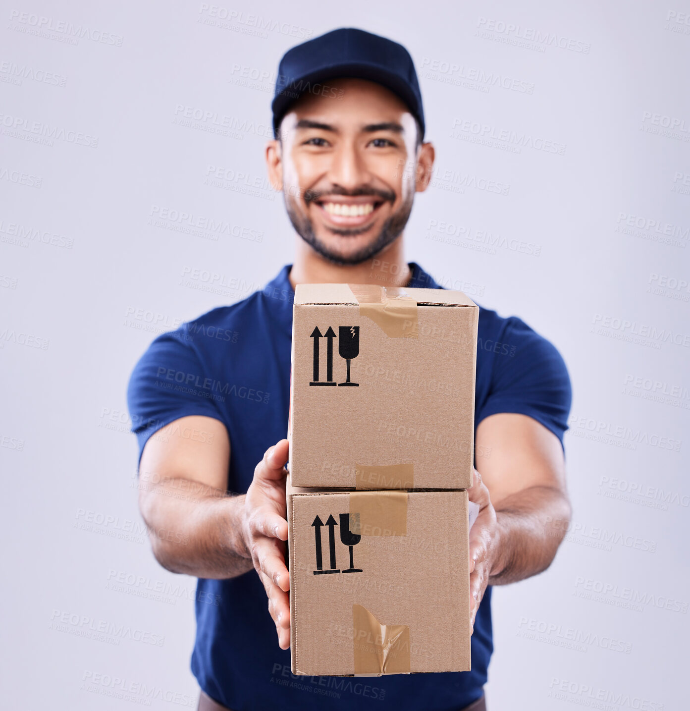 Buy stock photo Smile, portrait and delivery guy with boxes in studio, safe transport for ecommerce supplier product. Package, logistics and happy courier mail man on white background for giving sales and services.