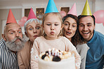 Birthday cake, candles and big family celebrate in a home party, event and happiness in a house together. Mother, father and grandparents excited for surprise gathering with children or kids