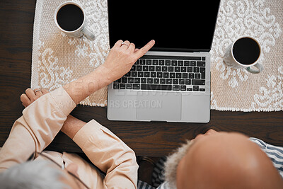 Buy stock photo Laptop, couple and hands of woman point at screen on living room table for comic show, internet video or film. Technology, people and watching tv on computer for relax and streaming with coffee