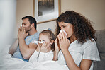 Parents, girl and bed with tissue, blowing nose and sick together with allergies, flu or covid in house. Father, mother and daughter with toilet paper, cleaning and hygiene for sneeze in family home