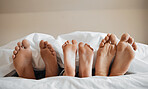 Feet, parents and kid sleeping on bed to relax with love, rest and sleeping on hotel mattress for vacation. Parents, sleep and bedroom with child, mother and father for bonding, care and family house