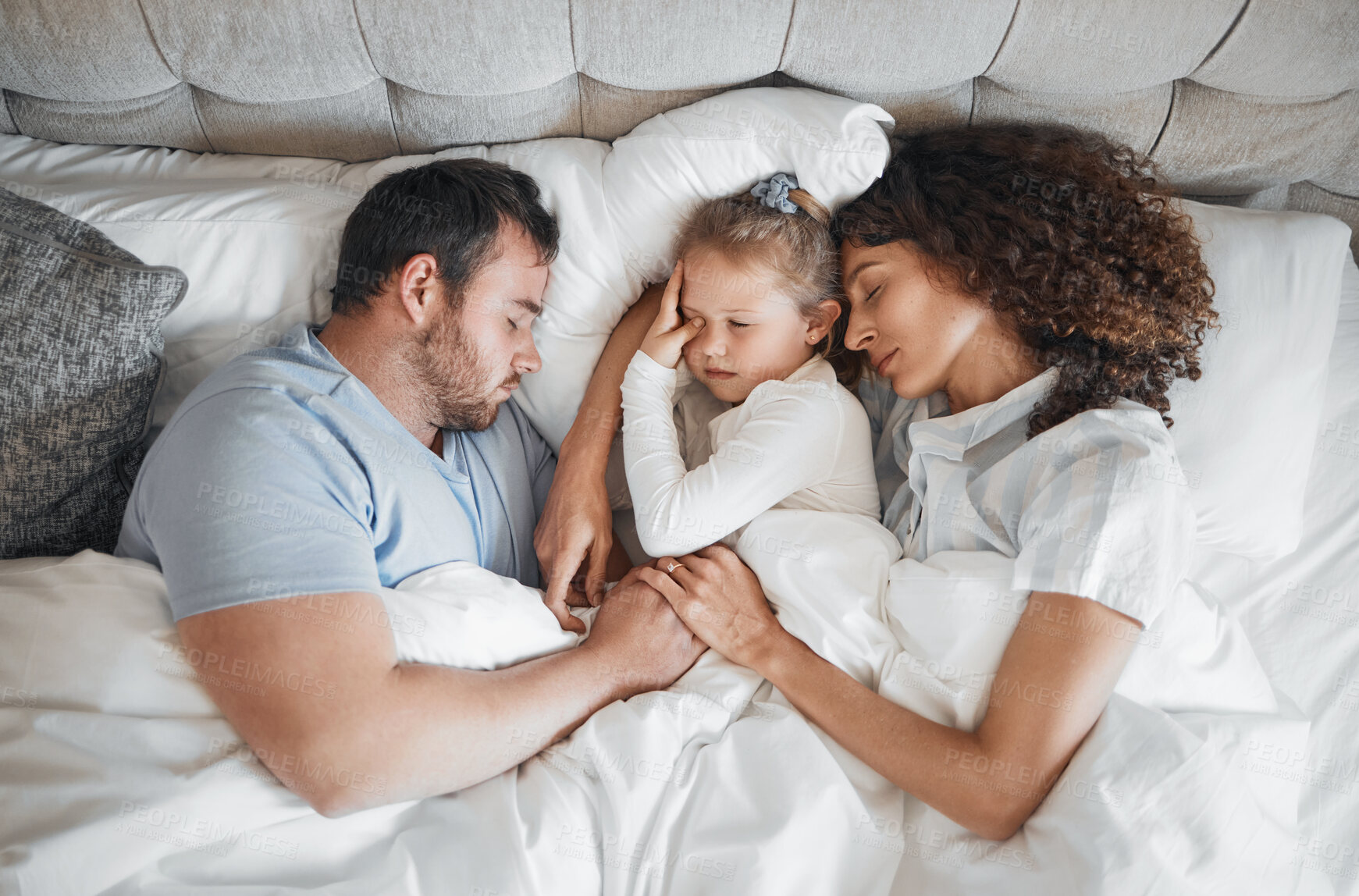 Buy stock photo Top view, family and parents with child in bed for bonding, healthy relationship and sleeping at home. Morning, love and above of mother, father and girl in bedroom asleep for comfort, cuddle or love