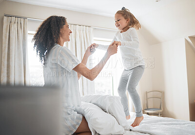 Buy stock photo Bed, mother and girl in a home, jump and family with love, weekend break and playing together. Parent, kid and child in a bedroom, fun and happiness with activity, morning and cheerful with energy