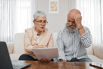 Buy stock photo Budget, documents and senior couple with stress planning financial investments, mortgage or tax papers. Elderly woman speaking of bills, debt and pension fund on bank statement to an old man at home 