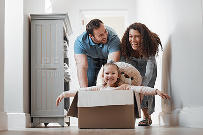 Buy stock photo Child playing, father or mother pushing box in new house in a race or game for bond, love or happiness. Dad, playful mom or excited girl kid in cardboard with support, smile or parents in family home