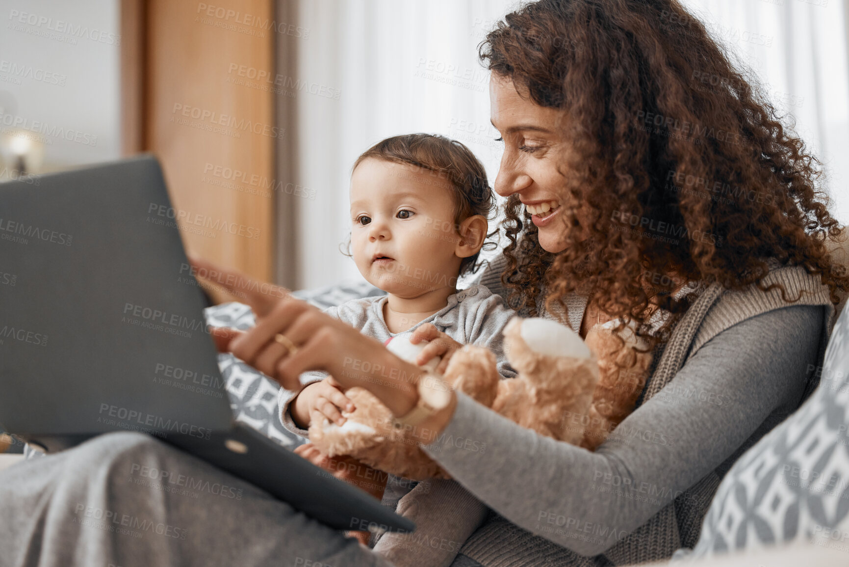 Buy stock photo Mother, laptop or child online for education, skills development or knowledge on house sofa. Pointing, talking or baby learning on social media or elearning course at home with mom or single parent