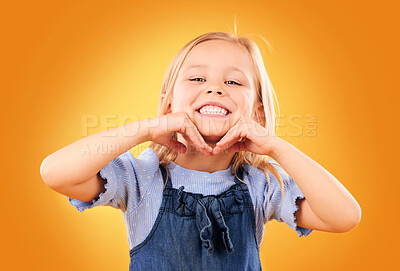 Buy stock photo Happy, smile and portrait of child on orange background with happiness, joy and excited in studio. Fashion, childhood and hands on face of girl in fun or trendy outfit, young style and summer clothes