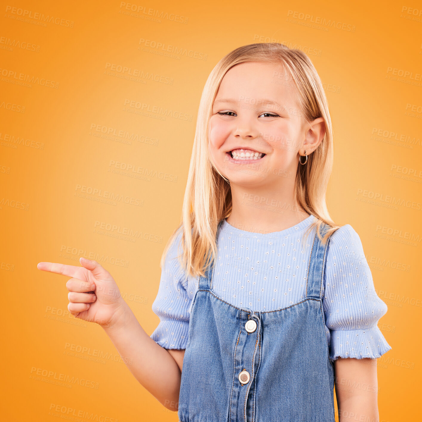 Buy stock photo Child, happy portrait and pointing in studio for advertising, announcement or promotion. Excited young girl kid on a orange background for hand gesture, sale or sign for attention or deal offer