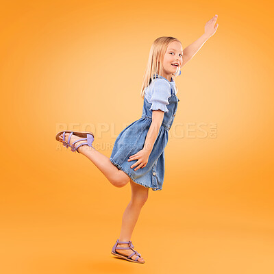 Buy stock photo Portrait, girl and kid with a smile, fly or fantasy with joy, happiness or excited on a yellow studio background. Person, model or child with power, hero game or imagine with energy, happy or playful