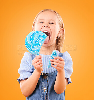 Buy stock photo Lollipop, candy and portrait of a child in studio for sweets, color spiral or sugar for energy. Face of happy girl kid excited on orange background to lick or eating snack, dessert or unhealthy food