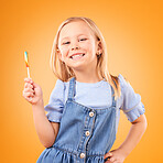 Child, lollipop or candy portrait in studio for sweet tooth, color spiral or sugar for energy. Face of happy girl kid on orange background for snack, excited smile and dessert or unhealthy food