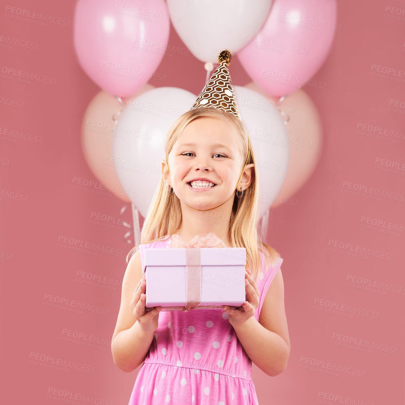 Buy stock photo Present, birthday and portrait of a child with balloons in studio for party, holiday or happy celebration. Excited girl on a pink background with gift box, hat and surprise package with a smile