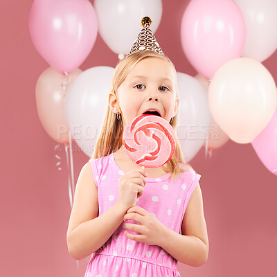 Buy stock photo Balloons, lollipop and portrait of child on pink background for birthday party, celebration and special day. Happy, excited and young cute girl smile with candy, sweet treats and dessert in studio