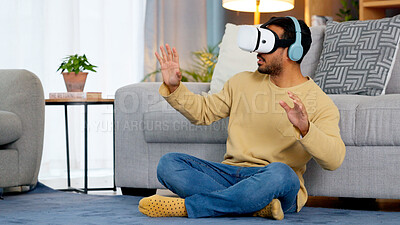 Buy stock photo Home, virtual reality glasses and man on the floor, metaverse and online game with fun in a living room. Person, futuristic or player with esports, tech or VR eyewear with headphones or stress relief