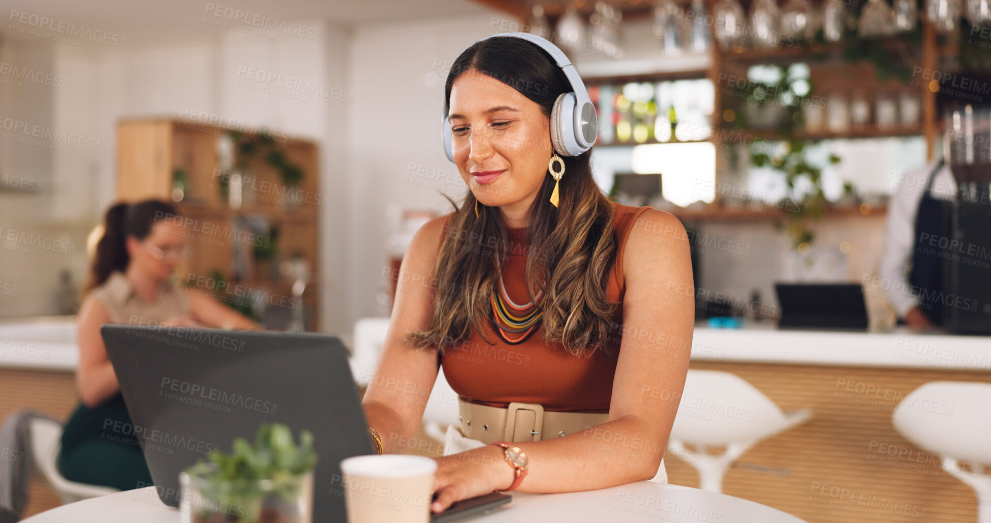 Buy stock photo Laptop, freelance and woman in coffee shop with headphones, online research career and smile. Communication, technology and remote work, happy girl in cafe at computer, virtual assistant and internet