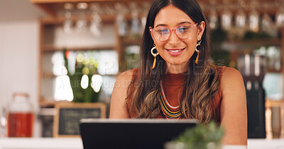 Buy stock photo Laptop, freelance and woman in coffee shop with glasses, online research career and smile. Communication, technology and remote work, happy girl in cafe at computer, virtual assistant and reflection.