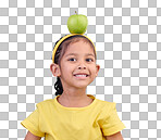 Portrait, smile and girl with apple on head on blue background for nutrition, healthy eating and diet. Food, youth and face of happy young girl in studio with fruit for organic, vitamins and wellness