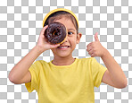 Donut, eye and thumbs up with portrait of girl in studio for junk food, sugar and happiness. Snack, cake and cute with face of child and dessert for cute, positive and chocolate on blue background