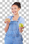 Portrait, smile and woman with burger, apple and choice in studio isolated on a blue background. Face, fruit and person with sandwich, fast food or decision for healthy diet, nutrition or wellness.