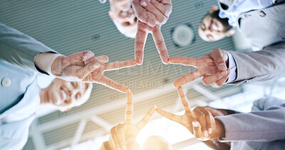 Star, teamwork or hands of business people in huddle for motivation, group mission or collaboration. Team building, low angle or colleagues in meeting with peace sign, vision or solidarity in office
