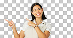 Woman is pointing, marketing and face on green screen, mockup space with product placement and smile. Advertising, branding and logo promo with happy female, show or display on studio background