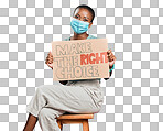 African american covid vaccinated woman showing, holding poster and wearing surgical face mask. Happy black model isolated on red studio background with copyspace. Promoting corona vaccine with sign