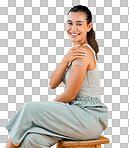 Mixed race covid vaccinated woman showing plaster on arm and smiling. Portrait of hispanic model isolated against yellow studio background with copyspace. Protected from corona with vaccine injection