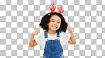 Happy, Christmas and thumbs up with girl in studio for holiday, festive and agreement. Approval, yes and like with child and deer headband on green background for satisfaction, smile and good news