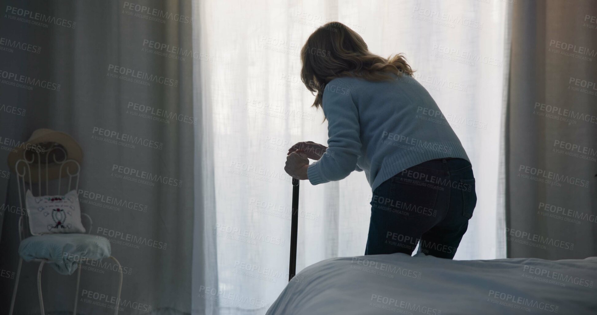 Buy stock photo Balance, medical and window with old woman and walking stick in bedroom for wellness, retirement and healthcare. Depression, mental health and nursing home with patient with a disability for support