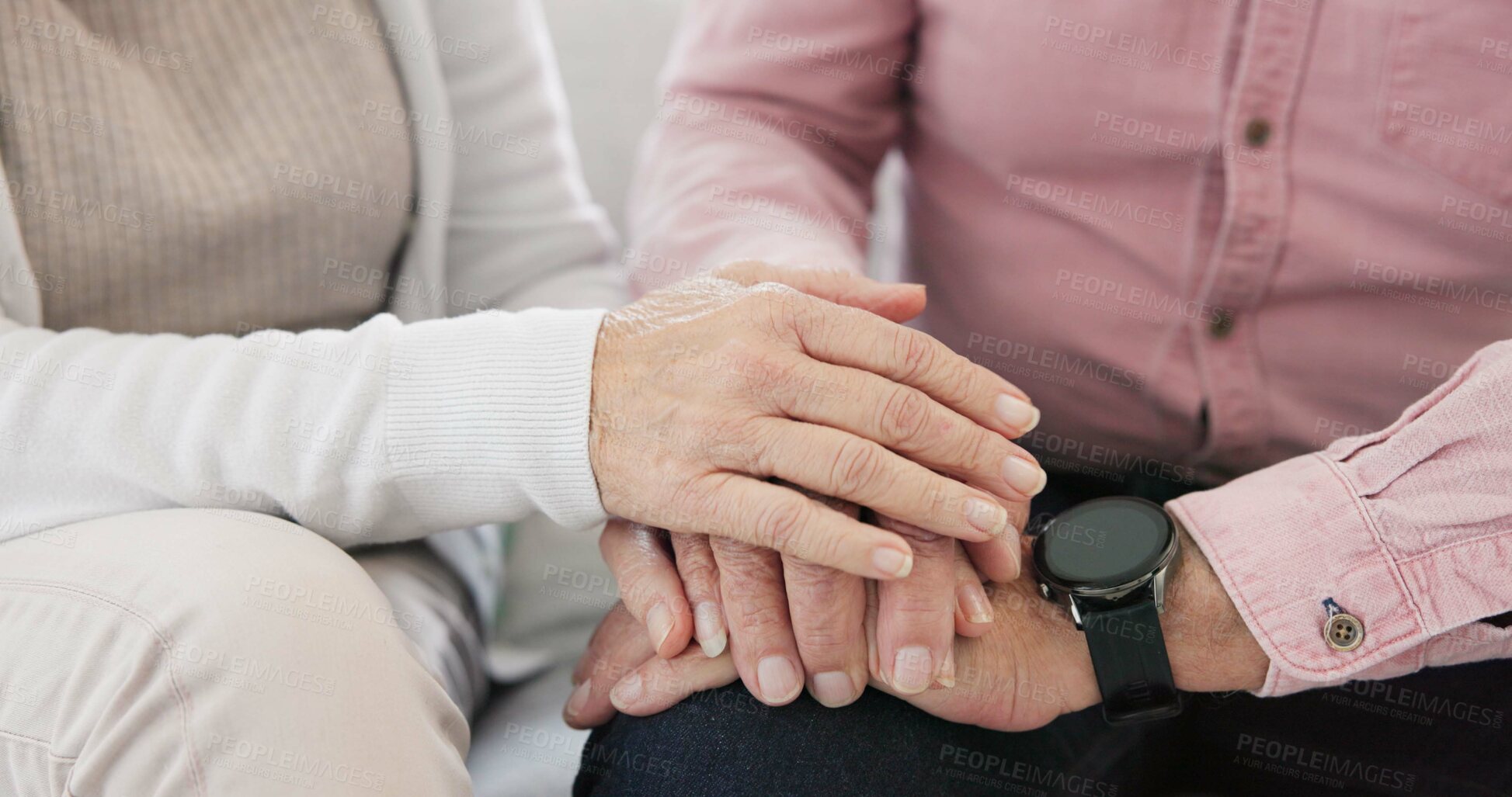 Buy stock photo Closeup of senior couple holding hands for love, care and trust in retirement. Old man, woman and helping hand for loyalty to partner in kindness, hope and support to forgive, with empathy at home