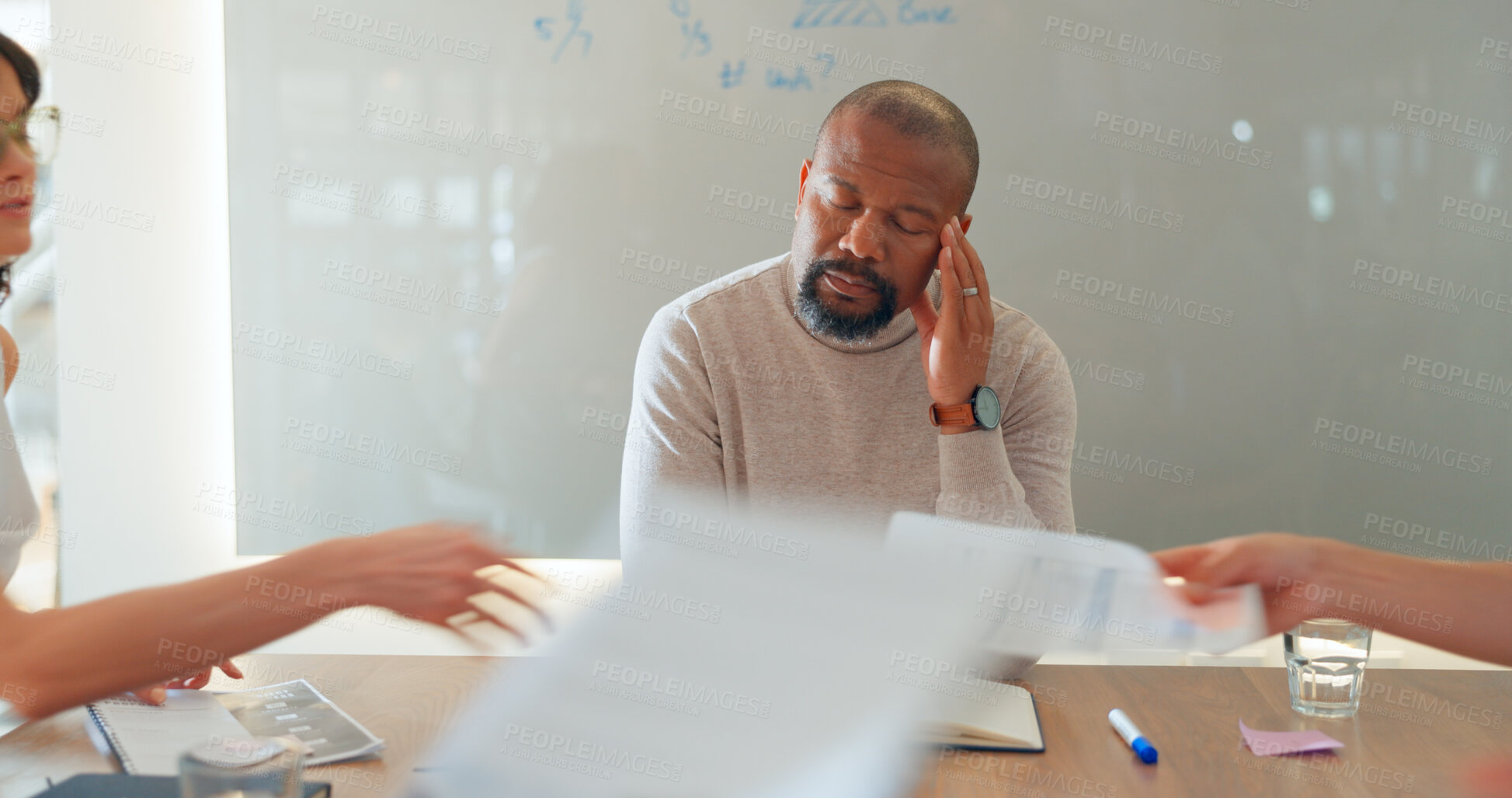 Buy stock photo Tired, businessman and headache in meeting with paperwork, people and fatigue in office or conference room. Team, manager and employee with burnout, migraine or anxiety for documents and report