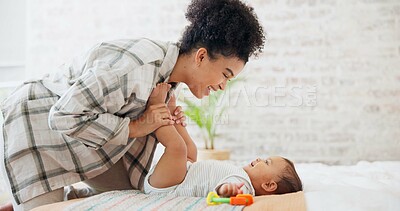Mother, baby or child with a toy for development, learning and growth in family home. Cute toddler or infant kid with woman or parent for love, care and security while playing for mobility in bedroom