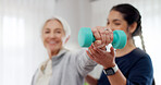 Woman, nurse and dumbbell in elderly care for physiotherapy, exercise or workout at old age home. Female doctor, caregiver or personal trainer helping senior patient in weightlifting for healthy body