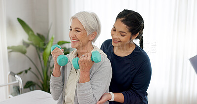 Woman, nurse and dumbbell with senior patient in physiotherapy, exercise or workout at old age home. Female doctor caregiver or personal trainer helping in elderly care, weightlifting or healthy body