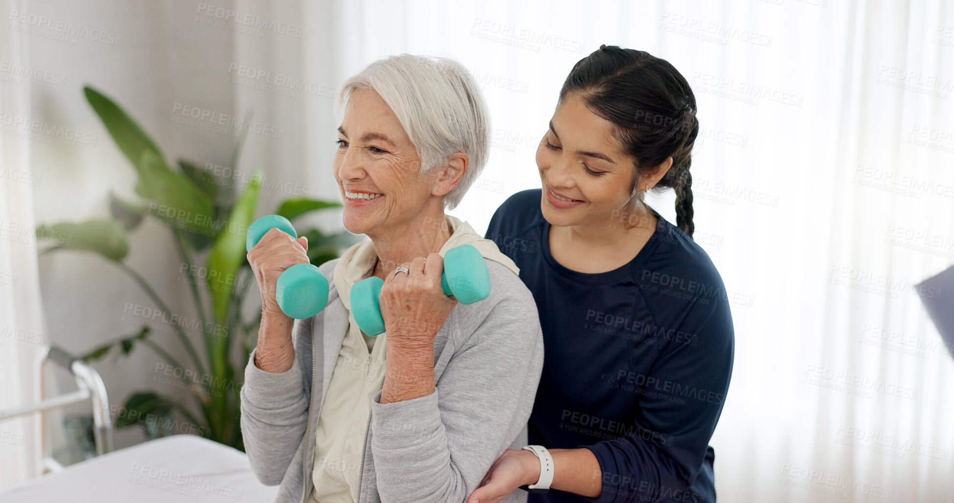 Buy stock photo Senior woman, physiotherapy and exercise with dumbbell for medical consulting, muscle rehabilitation and healing. Physiotherapist support happy patient with weights, orthopedic assessment or mobility