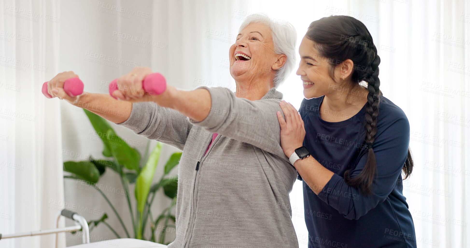 Buy stock photo Senior woman, physiotherapist and smile with dumbbell for medical consulting, muscle rehabilitation and healing. Physiotherapy, support and healthcare assessment with weights for orthopedic exercise