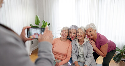 Senior fitness, women and person with a photo for a yoga, exercise or workout memory together. Smile, group and coach taking picture of elderly friends at a training studio for a class in retirement