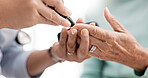 Hands, diabetes and a doctor with a patient and tools for a healthcare check with a finger prick. Closeup, service and a nurse with a person and machine for sugar or glucose exam from a blood sample