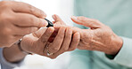 Hands, diabetes test and a doctor with a patient for a healthcare check with a finger prick. Closeup, service and a nurse with a person and machine for sugar or glucose exam from a blood sample