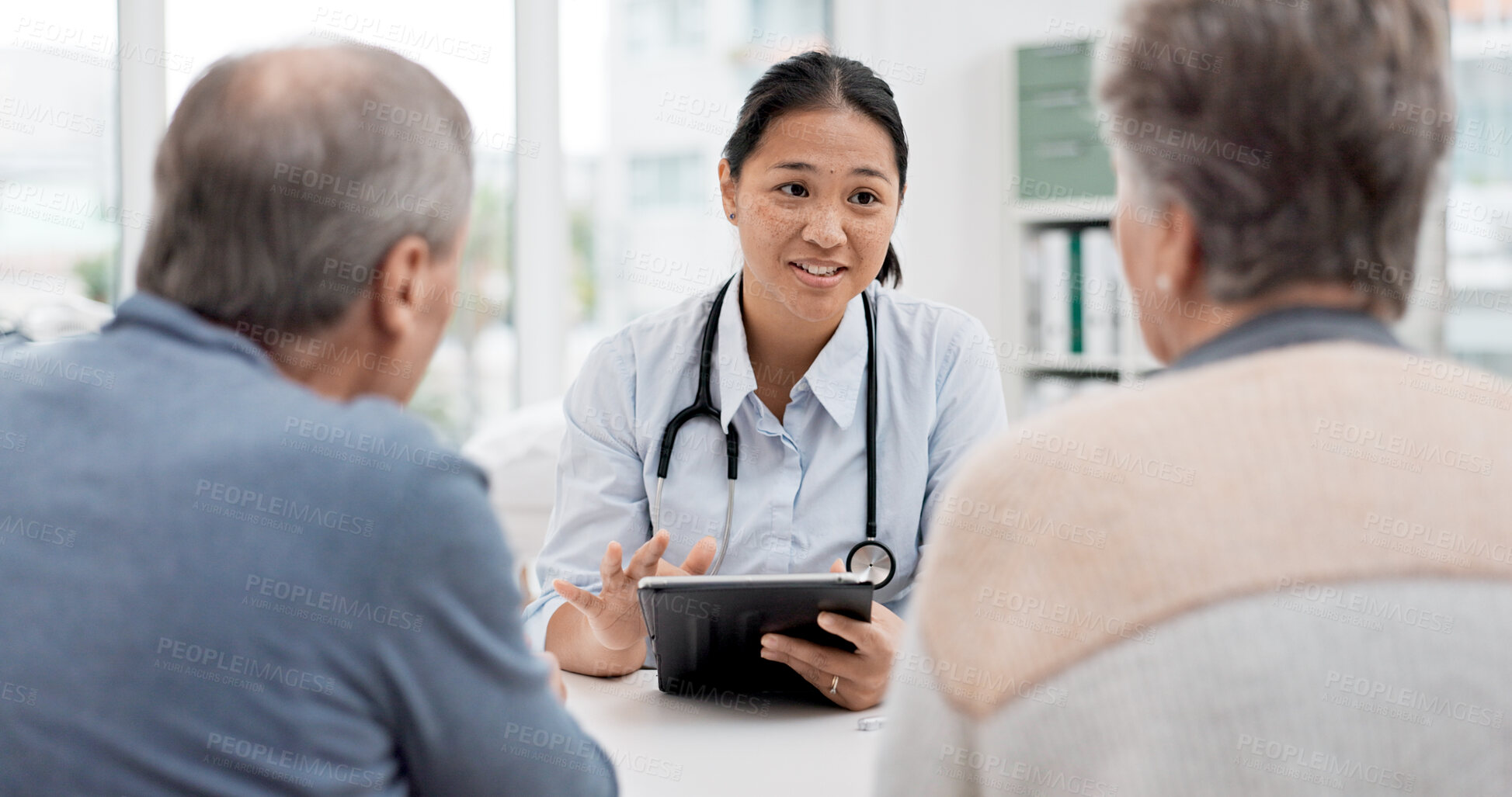 Buy stock photo Medical consultation, tablet and senior couple, doctor and talk to client, explain hospital service or healthcare insurance. Discussion, good results or happy cardiology worker consulting old people