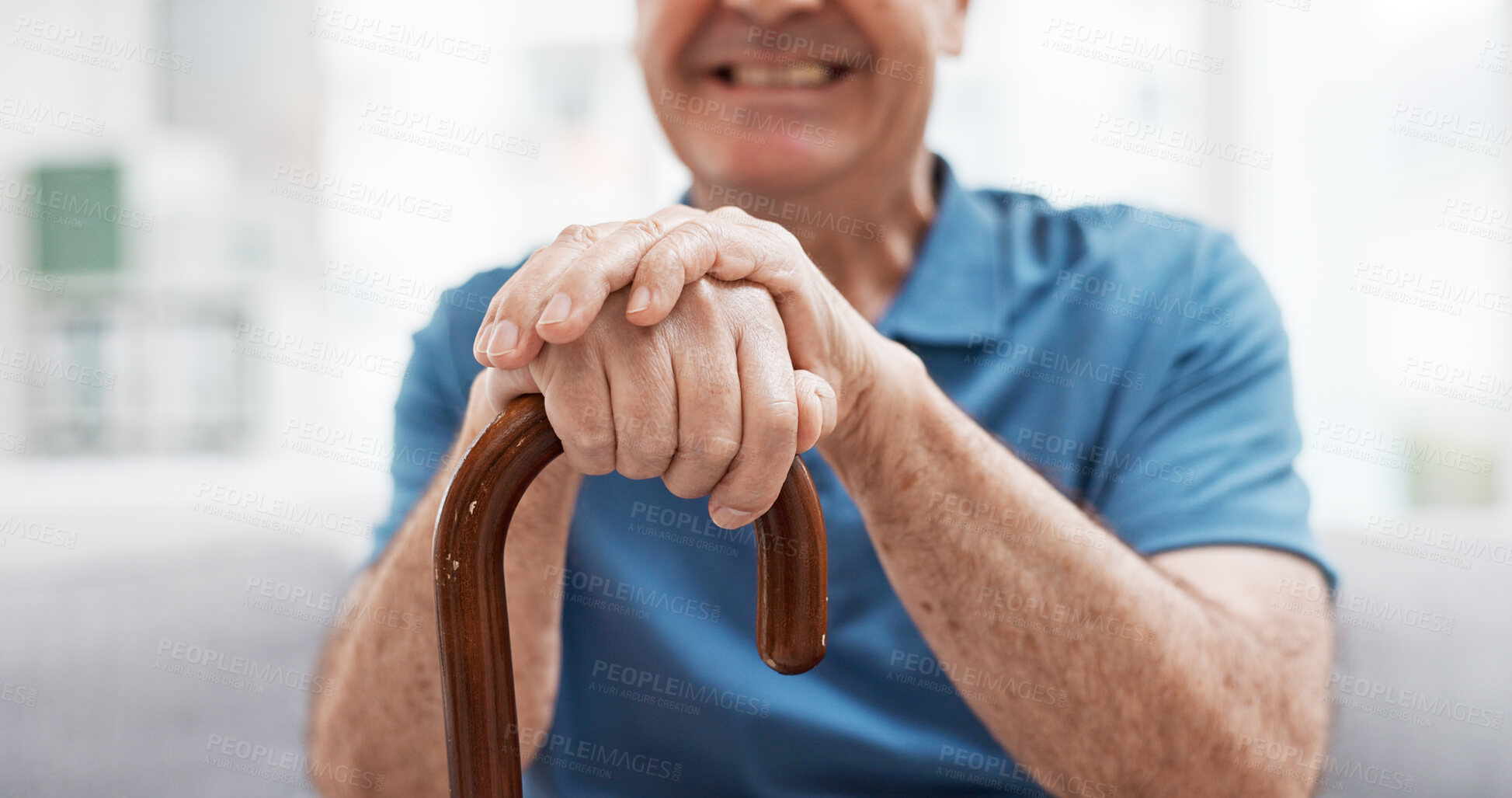 Buy stock photo Walking stick, hands and happy elderly man with wooden cane on sofa for balance, support and mobility. Walk, aid and old male at senior care facility with disability, dementia or chronic arthritis