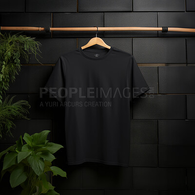 Buy stock photo Black t-shirt mockup with copyspace on dark background with plants on hanger, front view