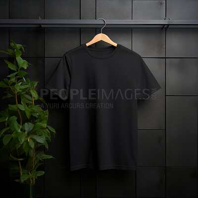 Black t-shirt mockup with copyspace on dark background with plants on hanger, front view