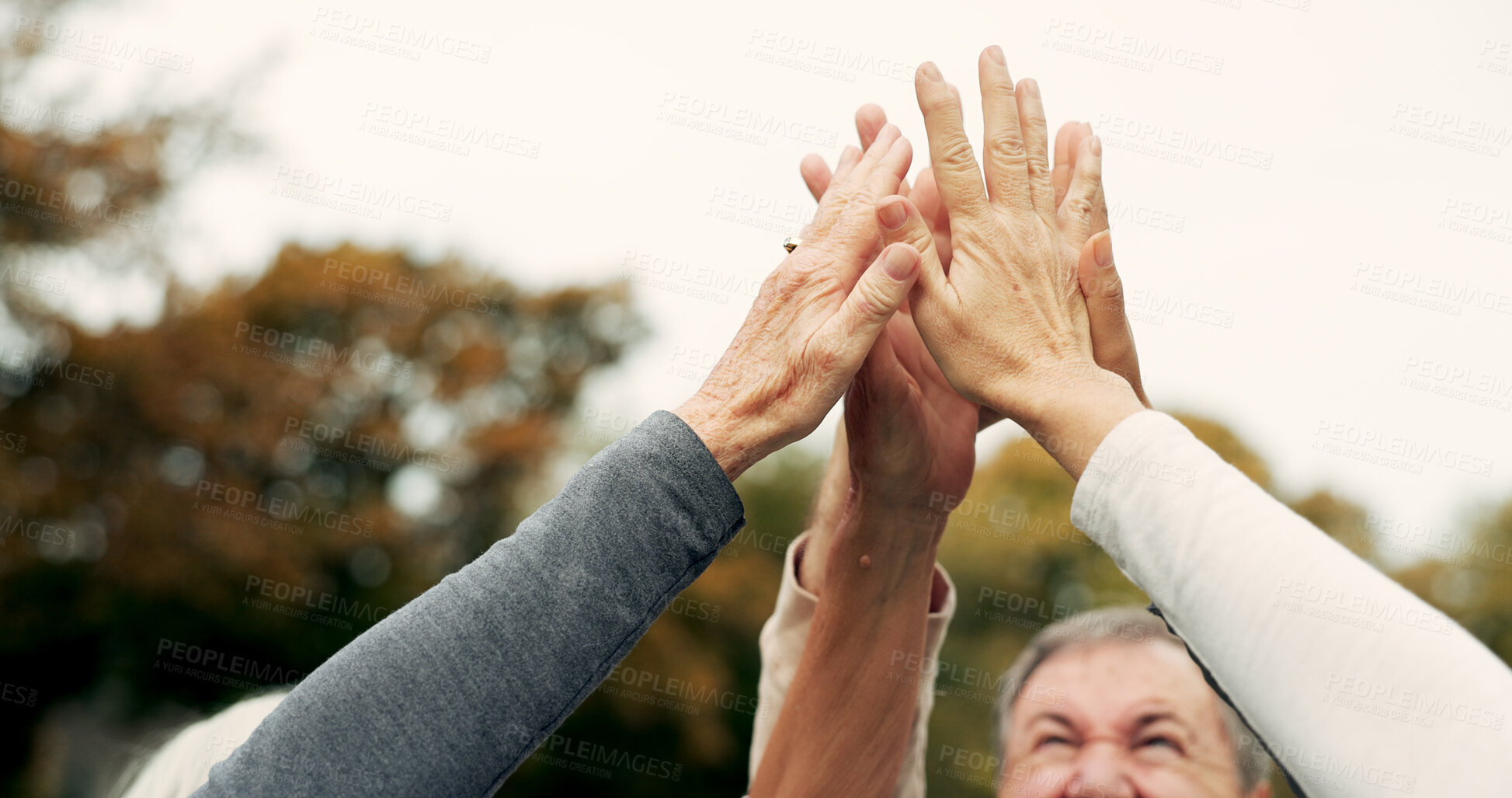 Buy stock photo High five, partnership and a group of senior friends together in a park for motivation, success or celebration. Team building, support and community with elderly people bonding outdoor in a garden