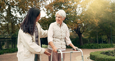 Buy stock photo Park, walker and woman help senior walking as support, trust and care for morning healthcare exercise or workout. Health, physical therapy and elderly with caregiver for outdoor rehabilitation