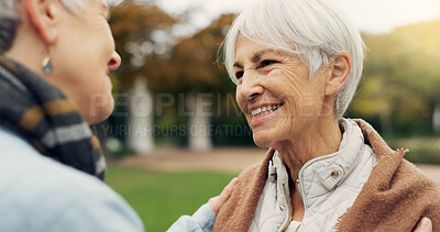 Love, care and senior women embracing for affection, romance and bonding on an outdoor date. Nature, commitment and elderly female couple in retirement hugging in a green garden or park together.
