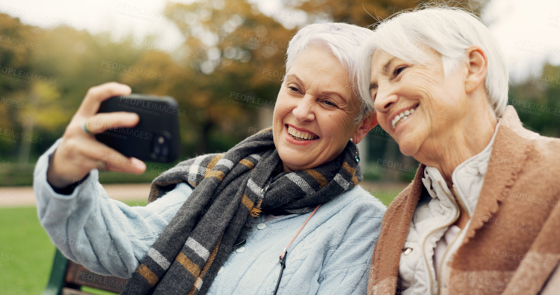 Buy stock photo Senior, women and selfie in a park happy, bond and relax in nature on a bench together. Friends, old people and ladies smile for social media, profile picture or memory in forest chilling on weekend