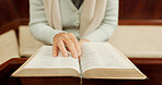 Studying, bible or hands of woman in church ready to worship God, holy spirit or religion in Christian cathedral. Faith closeup, learning or lady reading book in chapel praying to praise Jesus Christ